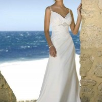 Beach wedding gown features in satin and drapes in a modified silhouette