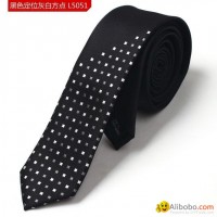 Background black with grey and white blocks polyester woven neck tie